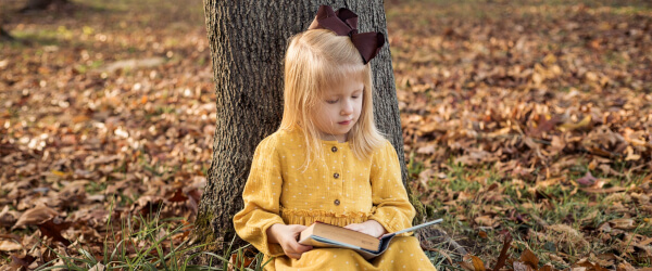 A'zalea reading under a tree