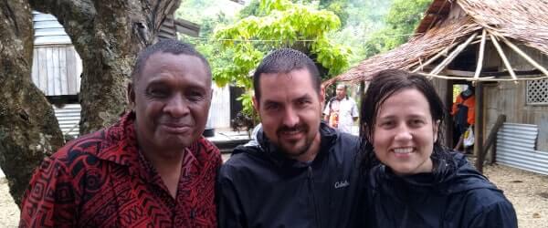Harold and Justine standing with Bishop Edoni, one of the Papuan church leaders.
